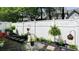 Charming patio with furniture, plants, and a white privacy fence at 2410 Clock Face Ct, Lawrenceville, GA 30043