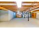 Spacious unfinished basement with wooden ceiling beams, offering ample potential for customization and storage at 2668 Kings Park Cir, Decatur, GA 30034