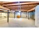 Unfinished basement with exposed ceiling, providing ample storage and potential for customization at 2668 Kings Park Cir, Decatur, GA 30034