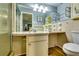 Functional bathroom featuring a shower, toilet, sink, vanity, and ample countertop space with floral decor at 2668 Kings Park Cir, Decatur, GA 30034