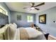 Comfortable bedroom with ceiling fan, ample natural light, and tasteful decor creating a cozy and inviting space at 2668 Kings Park Cir, Decatur, GA 30034