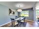 Bright dining area with modern light fixture and a large window at 2668 Kings Park Cir, Decatur, GA 30034