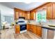 Spacious kitchen features stainless steel appliances and granite counters open to living area at 2668 Kings Park Cir, Decatur, GA 30034
