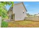 Backyard features a fenced yard, patio area, and lush green surroundings at 307 Lee Miller Dr, Suwanee, GA 30024