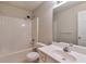 Bathroom features a large mirror, sink, toilet and shower/tub combo at 307 Lee Miller Dr, Suwanee, GA 30024