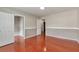 Bedroom with hardwood floors, neutral paint, and a walk-in closet at 307 Lee Miller Dr, Suwanee, GA 30024