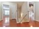 Inviting hallway with wood floors leads to multiple rooms and staircase at 307 Lee Miller Dr, Suwanee, GA 30024