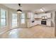 Bright kitchen with ample natural light, white cabinets, marble countertops, tile flooring and backyard access at 307 Lee Miller Dr, Suwanee, GA 30024