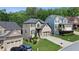 Residential street view of the two story house displaying the landscape and surrounding homes at 456 Crestmont Ln, Canton, GA 30114