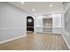 Finished basement offers built-in media, vinyl floors, and natural light providing an inviting entertainment space at 456 Crestmont Ln, Canton, GA 30114