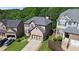 Charming home featuring a well-kept lawn, neutral-colored siding, and a two-car attached garage, perfect for families at 456 Crestmont Ln, Canton, GA 30114
