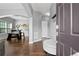 Inviting home foyer with hardwood floors, a bench, and an archway to the dining area at 456 Crestmont Ln, Canton, GA 30114
