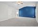 Spacious main bedroom with a blue accent wall and ensuite bathroom at 456 Crestmont Ln, Canton, GA 30114