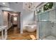 Bright bathroom featuring freestanding tub, walk-in shower, and open entrance to closet at 710 Devon Hill Ct, Roswell, GA 30075