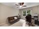 Versatile bedroom currently staged as office space with large window at 710 Devon Hill Ct, Roswell, GA 30075