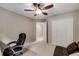 Bedroom with closet and desk, staged as office or guest room at 710 Devon Hill Ct, Roswell, GA 30075