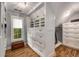 Walk-in closet featuring custom shelving and drawers for clothing and accessories at 710 Devon Hill Ct, Roswell, GA 30075