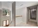 Bright hallway with beautiful chandelier and double doors at the entrance at 710 Devon Hill Ct, Roswell, GA 30075