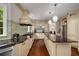 Chef's kitchen with professional grade appliances, large island, granite countertops, and ample storage at 710 Devon Hill Ct, Roswell, GA 30075