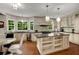 Gourmet kitchen with large island, stainless steel appliances, granite countertops, and custom cabinetry at 710 Devon Hill Ct, Roswell, GA 30075