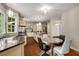 Spacious kitchen with stainless steel appliances, granite countertops, and hardwood floors at 710 Devon Hill Ct, Roswell, GA 30075