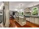 Gourmet kitchen featuring an island, custom cabinets, and stainless steel appliances at 710 Devon Hill Ct, Roswell, GA 30075