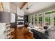 Bright living room featuring a fireplace, hardwood floors, and views to the outdoor patio at 710 Devon Hill Ct, Roswell, GA 30075