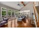 Open-concept living room with hardwood floors, fireplace, and a view into the kitchen at 710 Devon Hill Ct, Roswell, GA 30075