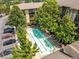 Aerial view of the community pool with lounge chairs and parking offering a complete look at the complex at 1195 Milton Se Ter # 1407, Atlanta, GA 30315