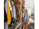 Walk-in closet with custom shelving, hanging rods, and a vanity table at 1195 Milton Se Ter # 1407, Atlanta, GA 30315