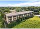 A multi-story apartment building with balconies overlooks a grassy area, perfect for enjoying the outdoors at 1195 Milton Se Ter # 1407, Atlanta, GA 30315
