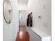 Hallway with wood floors, coat rack, storage and a mirror on the wall at 1195 Milton Se Ter # 1407, Atlanta, GA 30315