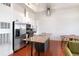 Modern kitchen with stainless steel appliances, an island with bar seating, and white cabinets at 1195 Milton Se Ter # 1407, Atlanta, GA 30315