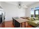 Modern kitchen with stainless steel appliances, an island with bar seating, and access to the balcony at 1195 Milton Se Ter # 1407, Atlanta, GA 30315