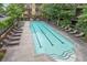 Inviting community pool featuring lounge chairs and a grilling area, perfect for outdoor relaxation and entertainment at 1195 Milton Se Ter # 1407, Atlanta, GA 30315