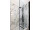 Modern shower with rainfall showerhead and marbled walls, creating a spa-like experience at 1195 Milton Se Ter # 1407, Atlanta, GA 30315