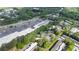 Aerial view featuring a shopping center surrounded by trees and apartments at 305 Winding River Village Dr # F, Atlanta, GA 30350