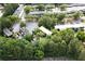 An aerial view of apartments nestled among lush trees with ample parking and well-maintained surroundings at 305 Winding River Village Dr # F, Atlanta, GA 30350