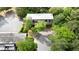 Aerial view of condo featuring spacious parking lot, and trees surrounding the property at 305 Winding River Village Dr # F, Atlanta, GA 30350