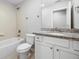 Bright bathroom featuring a subway tiled shower and granite vanity at 305 Winding River Village Dr # F, Atlanta, GA 30350