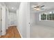Bedroom featuring a ceiling fan, carpet flooring, and large window with natural light at 305 Winding River Village Dr # F, Atlanta, GA 30350
