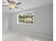 Bright bedroom with large window, neutral walls, and crown molding detail at 305 Winding River Village Dr # F, Atlanta, GA 30350