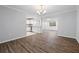Dining area that overlooks the kitchen with white cabinets and stainless appliances at 305 Winding River Village Dr # F, Atlanta, GA 30350