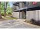 Exterior of building, showing fenced patios, landscaping, and parking at 305 Winding River Village Dr # F, Atlanta, GA 30350