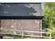 Two-story condo featuring brick exterior and dark gray roof in a wooded location at 305 Winding River Village Dr # F, Atlanta, GA 30350