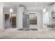 Modern kitchen featuring stainless steel refrigerator, granite countertops, and a sliding glass door at 305 Winding River Village Dr # F, Atlanta, GA 30350