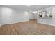 Open-concept living space with wood floors and bright natural lighting at 305 Winding River Village Dr # F, Atlanta, GA 30350