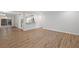 Bright living room with wood floors and sliding glass door to backyard at 305 Winding River Village Dr # F, Atlanta, GA 30350