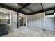 Covered patio with sliding glass door, outdoor light, and privacy fence at 305 Winding River Village Dr # F, Atlanta, GA 30350