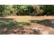 Cleared grassy lot with scattered trees, ready for construction or landscaping projects at 3443 Estes Dr, South Fulton, GA 30349